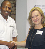 Outgoing chairman Mike Banda (left) congratulates Ann de Beer.